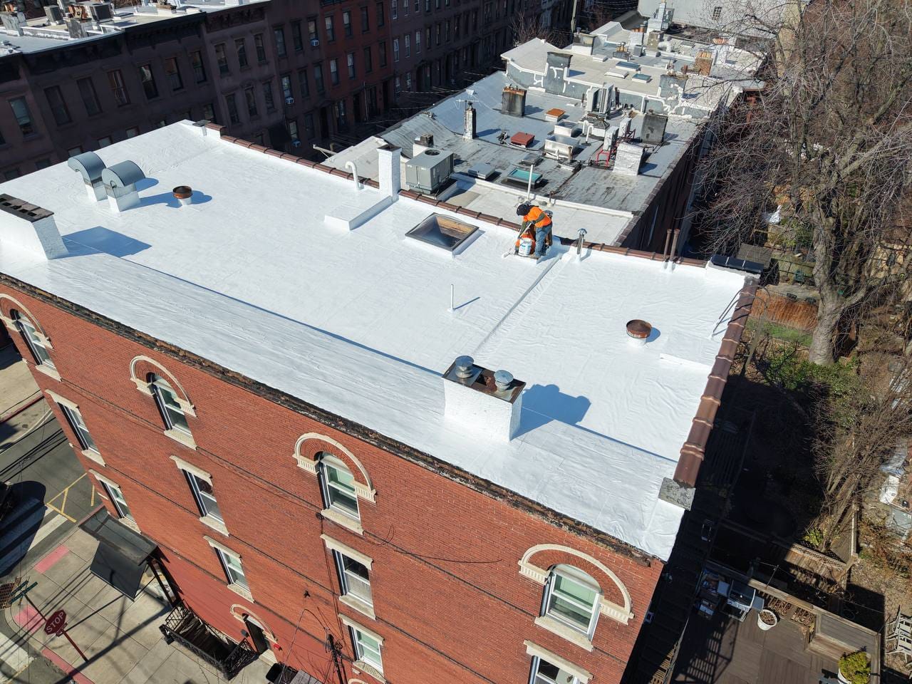 Custom flat roof drainage system installation for water management in NJ